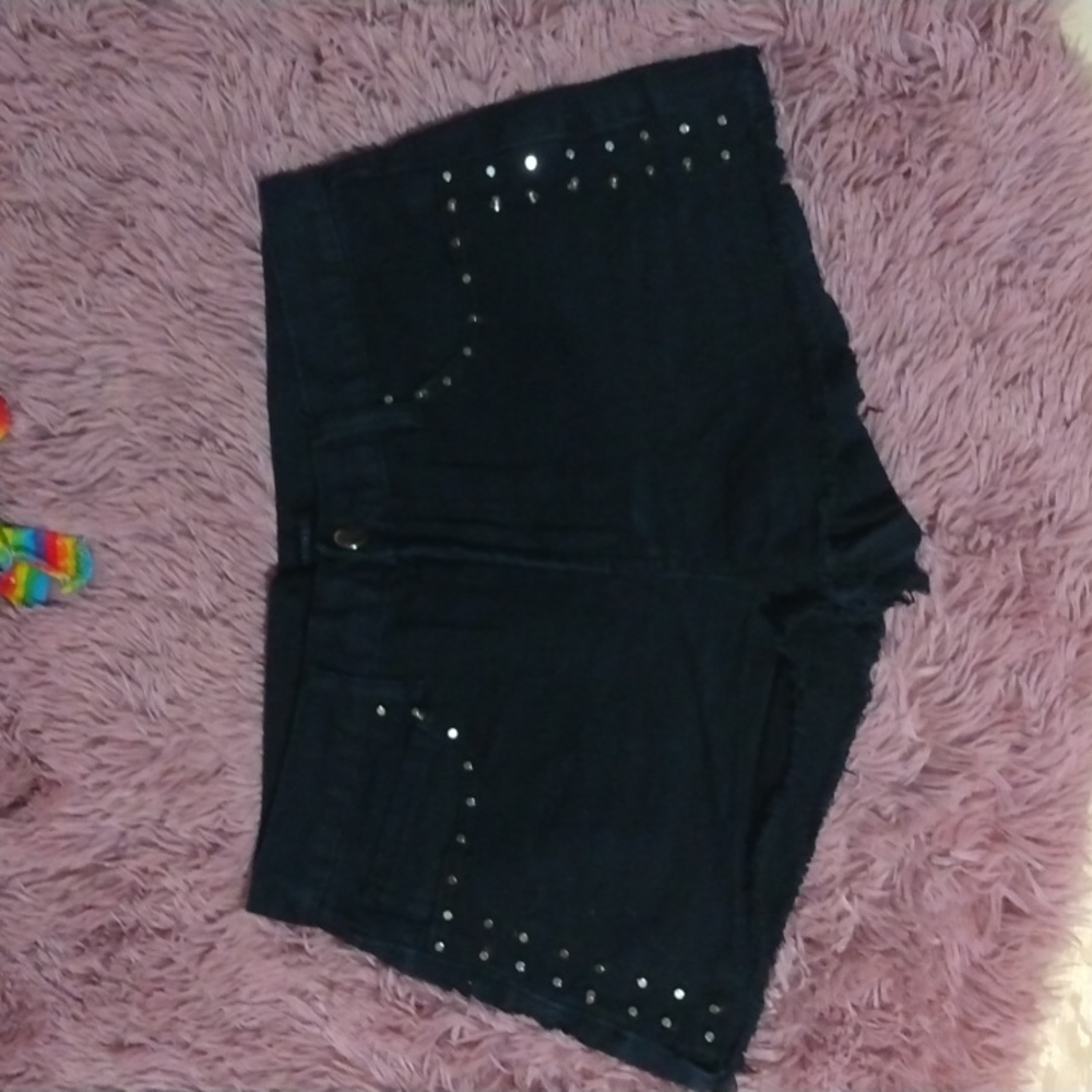Juniors black denim shorts with metal decoration